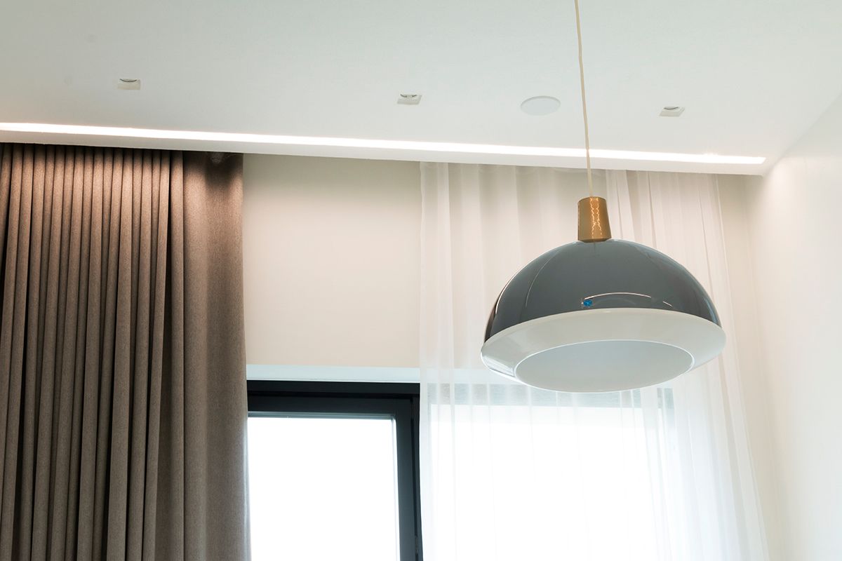 In the bedroom, a wide flush-mounted profile next to the curtains provides mood lighting. The wide flush-mounted profile can accommodate two LED strips side by side. Ledstore.fi